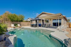 a swimming pool with a patio and a house at Stunning Phoenix Vacation Rental with Private Pool! in Phoenix