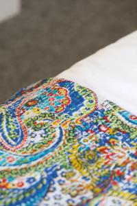 a close up of a colorful table cloth at Finest Retreats - Pittodrie Guest House - Room 3 in Brighton & Hove