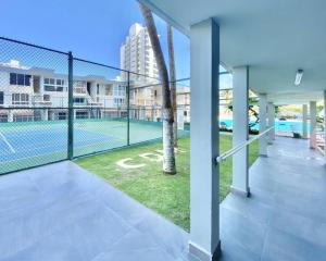 a tennis court in a building with a tennis court at KASA Poolside Balcony for 2 in San Juan