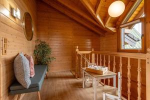 a room with a staircase in a wooden house at Panoramic Chalet Hot Tub, BBQ, view, terrace in Gönnersdorf