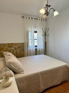 Postel nebo postele na pokoji v ubytování Casa El Chorreador