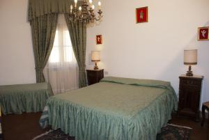 a bedroom with a bed and a window at Anacleto in Collodi