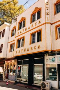 a building with a sign that reads karmaarma at Kaynarca Butik Hotel in İznik