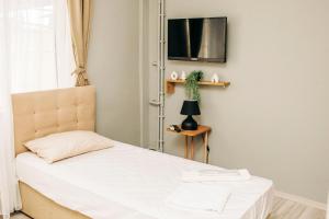 Postel nebo postele na pokoji v ubytování Kaynarca Butik Hotel