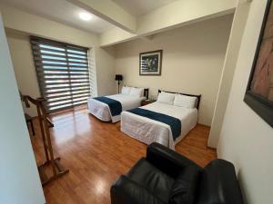 Voodi või voodid majutusasutuse HOTEL TRUEBA toas