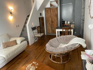 a living room with a couch and a table at Les remparts in Luz-Saint-Sauveur