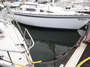 two boats are docked at a dock in the water at Vintage Sailboat in Belém in Lisbon