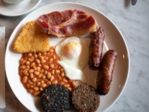 a plate of breakfast food with beans and eggs at Ashling House Ardara on Wild Atlantic Way F94T6N7 in Ardara