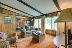 a living room with a couch and a table at Cozy Salmon Home with Mountain Views and River Access in Salmon