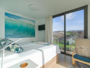 Łóżko lub łóżka w pokoju w obiekcie Salobre Villas Lagos