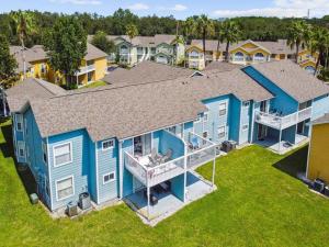 an overhead view of a blue house with a yard at Amazing 3bd/2ba Condo with water view @ Disney in Kissimmee
