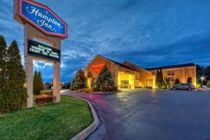 a hotel with a sign in front of a parking lot at Hampton Inn Morristown in Morristown