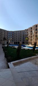 a park in front of a large apartment building at Princess resort unit number 260A Markos in Hurghada