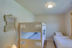 a bedroom with two bunk beds and a mirror at Idaho Vacation Rental Retreat Near Bear Lake in Paris
