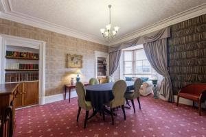 a dining room with a table and chairs at Pentland Hotel in Thurso