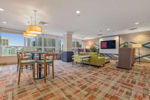 a hotel lobby with a dining area and a living room at Hilton Garden Inn New Orleans French Quarter/CBD in New Orleans