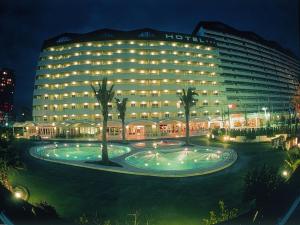 a hotel building with a large pool in front of it at AR Roca Esmeralda & SPA Hotel in Calpe