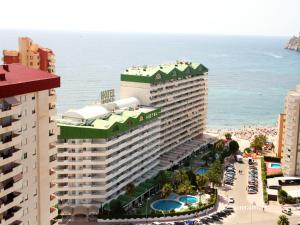 a hotel on the beach with the ocean in the background at AR Roca Esmeralda & SPA Hotel in Calpe