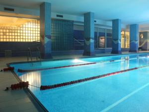 a large swimming pool in a building at AR Roca Esmeralda & SPA Hotel in Calpe