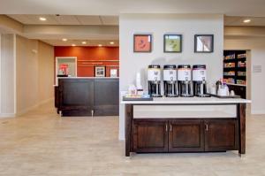 a pharmacy lobby with a counter with alcohol bottles at Hampton Inn & Suites Springfield Downtown in Springfield