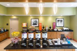 a counter with a bunch of bottles of wine at Hampton Inn - Palatka in Palatka