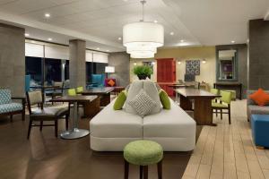 a lobby with a couch in the middle of a room at Home2 Suites By Hilton Macon I-75 North in Macon