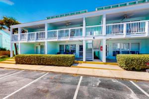 a building with a parking lot in front of it at Southwinds in Panama City Beach