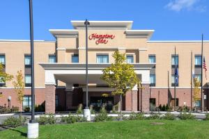 an office building with a christmas office sign on it at Hampton Inn Brighton Mi in Brighton