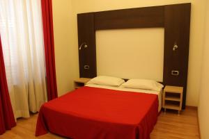 Postel nebo postele na pokoji v ubytování Hotel Louisiana