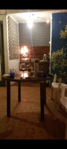 a wooden table in a room with a kitchen at Patio Urbano Suites & beds in Montevideo