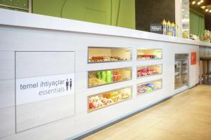 a supermarket checkout counter with the words term inflexible essentials at Hampton By Hilton Bolu in Bolu