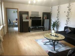 a living room with a couch and a table at Am Mühlenberg in Ohlweiler