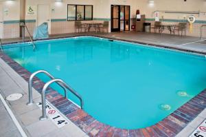 a large swimming pool with blue water at Doubletree By Hilton Helena Downtown in Helena