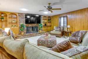 a living room with two couches and a fireplace at Spacious Little Rock Home with Patio - 9 Mi to Dtwn! in Little Rock