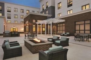 a patio with furniture and a fire pit in front of a building at Homewood Suites By Hilton Horsham Willow Grove in Horsham