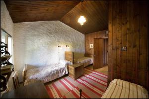 Postel nebo postele na pokoji v ubytování Agriturismo Famiglia al Castello Di Bagnolo