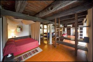 Postel nebo postele na pokoji v ubytování Agriturismo Famiglia al Castello Di Bagnolo