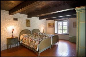 Postel nebo postele na pokoji v ubytování Agriturismo Famiglia al Castello Di Bagnolo