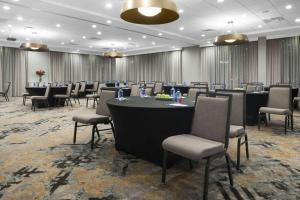 a conference room with a long table and chairs at Homewood Suites by Hilton DFW Airport South, TX in Fort Worth
