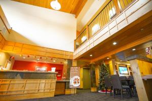 a restaurant with a christmas tree in the middle of a building at TownePlace Suites Old Mill District, Bend Near Mt Bachelor in Bend