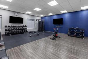 a room with a gym with exercise equipment and a tv at Hampton Inn & Suites Bloomfield Hills Detroit in Bloomfield Hills
