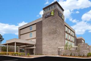 a rendering of the entrance to a planned office building at Home2 Suites By Hilton Blythewood, Sc in Blythewood