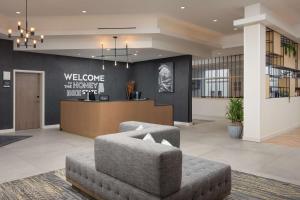 a lobby with a waiting area and a couch and a reception at Hampton Inn & Suites Huntsville Downtown, Al in Huntsville