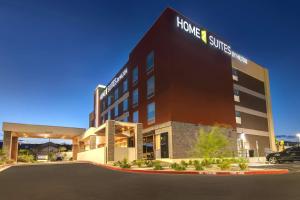 a hotel building with a sign that reads home and suites at Home2 Suites By Hilton Las Vegas Northwest in Las Vegas