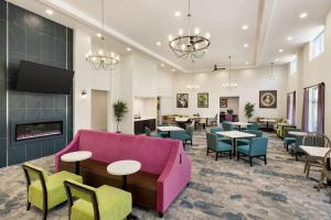 a lobby with a couch and tables and chairs at Homewood Suites By Hilton Carlisle in Carlisle