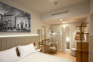 Postel nebo postele na pokoji v ubytování Cosmopolita Hotel Rome, Tapestry Collection by Hilton