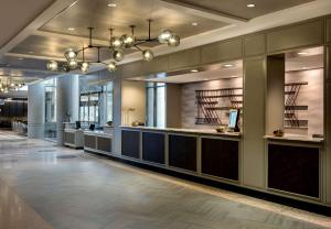 a lobby with a waiting area in a building at Embassy Suites by Hilton Bethesda Washington DC in Bethesda +24 photos