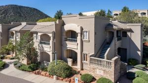 a large house with a staircase in front of it at Hilton Vacation Club Ridge on Sedona in Sedona