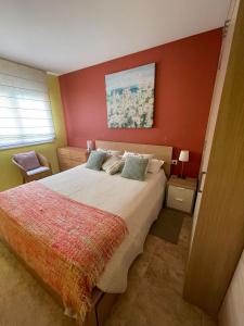 Un pat sau paturi într-o cameră la Cunit Beach