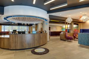 a lobby of a hospital with a reception desk at Tru By Hilton Raleigh Garner in Garner
